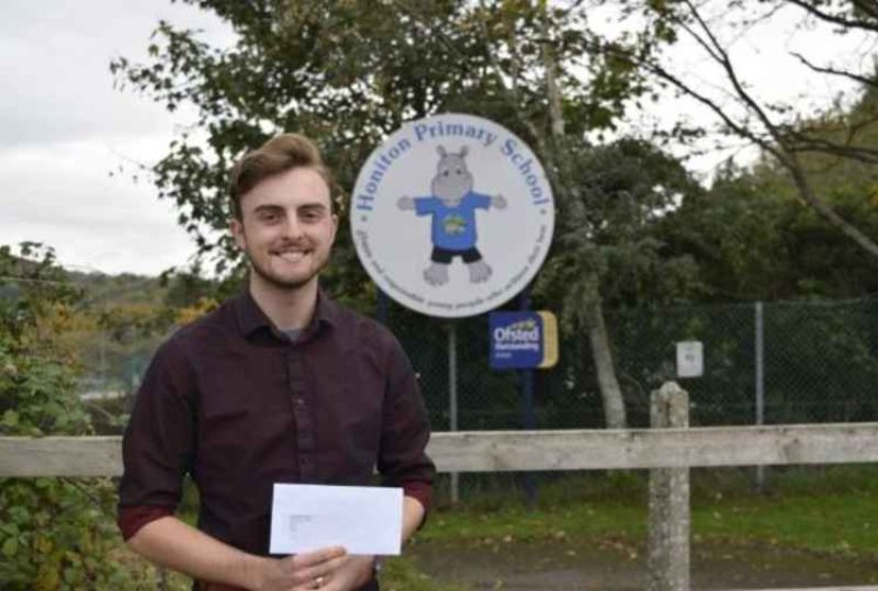 Jake Bonetta with letter in Honiton